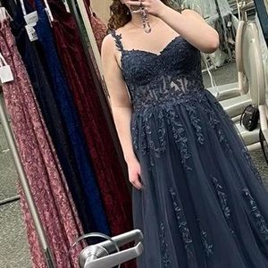 A size 10 prom dress from David’s bridal that is a shade of blue.